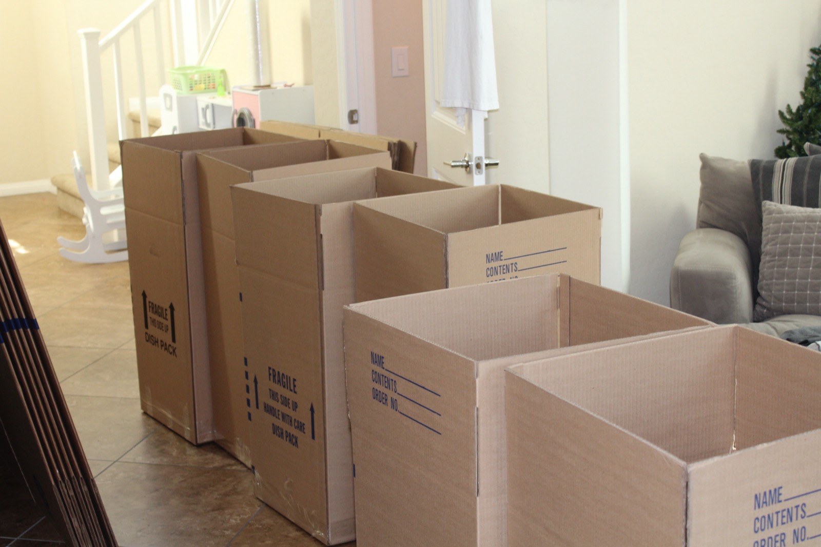 Cardboard moving boxes packed and ready for a house removal